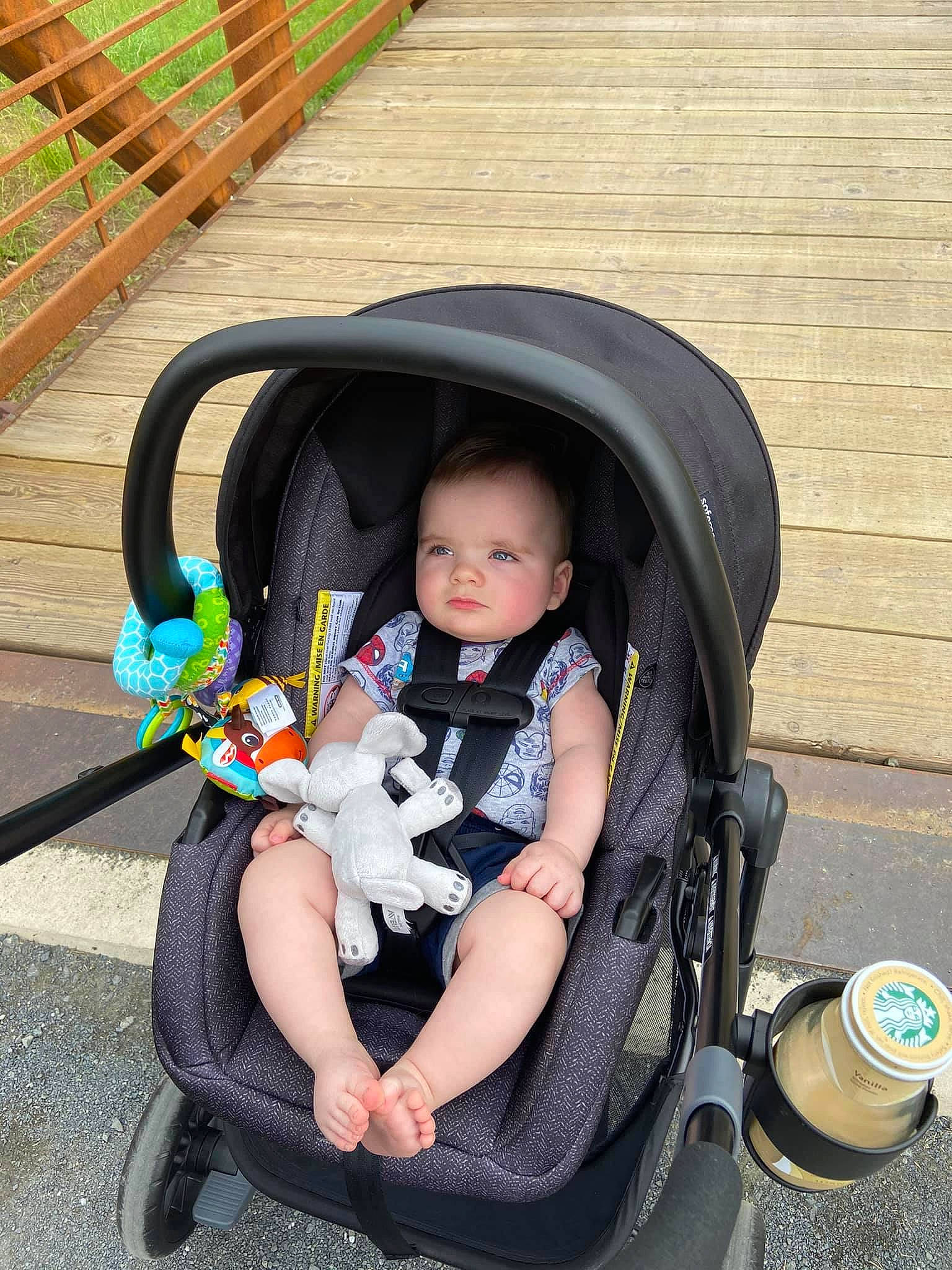 Donovan is registered to the contest to win money with this photo: auto_part, baby, baby_carriage, baby_products, baby_safety, baby_toddler_clothing, chair, child, comfort, fashion_accessory, fun, lap, leg, leisure, person, recreation, sitting, tire, toddler, toy