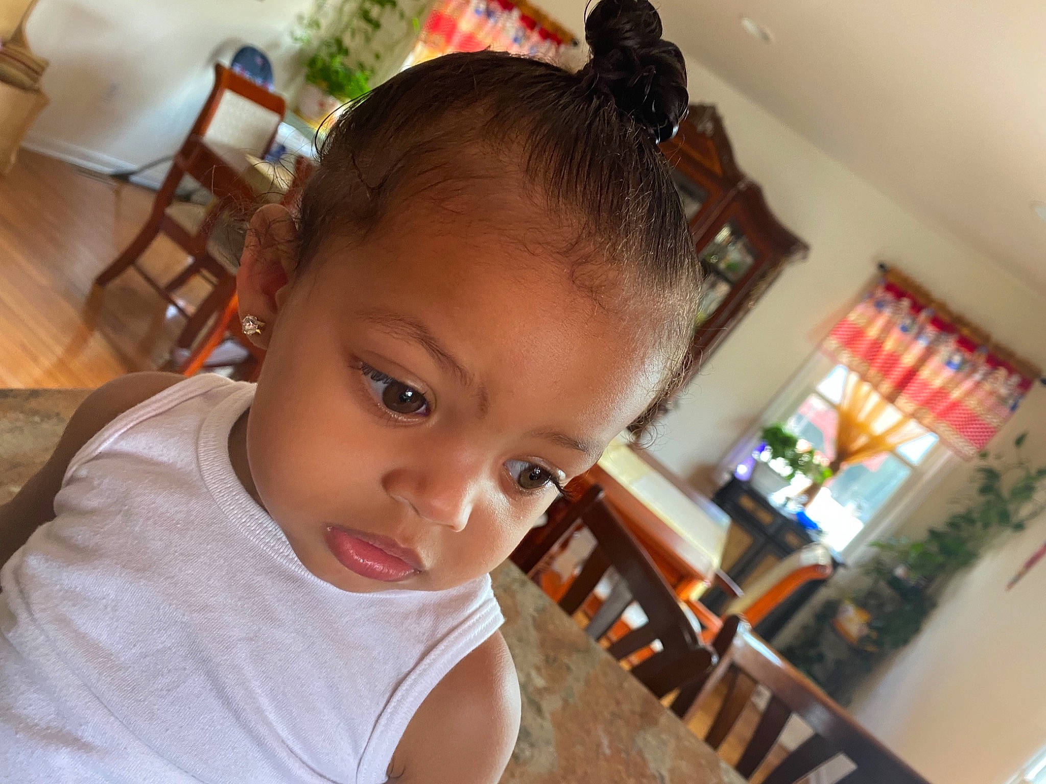 Jaelani is registered to the contest to win money with this photo: black_hair, chair, cheek, child, ear, eyebrow, eyelash, finger, forehead, fun, happy, houseplant, iris, nose, person, plant, skin, smile, t_shirt, table