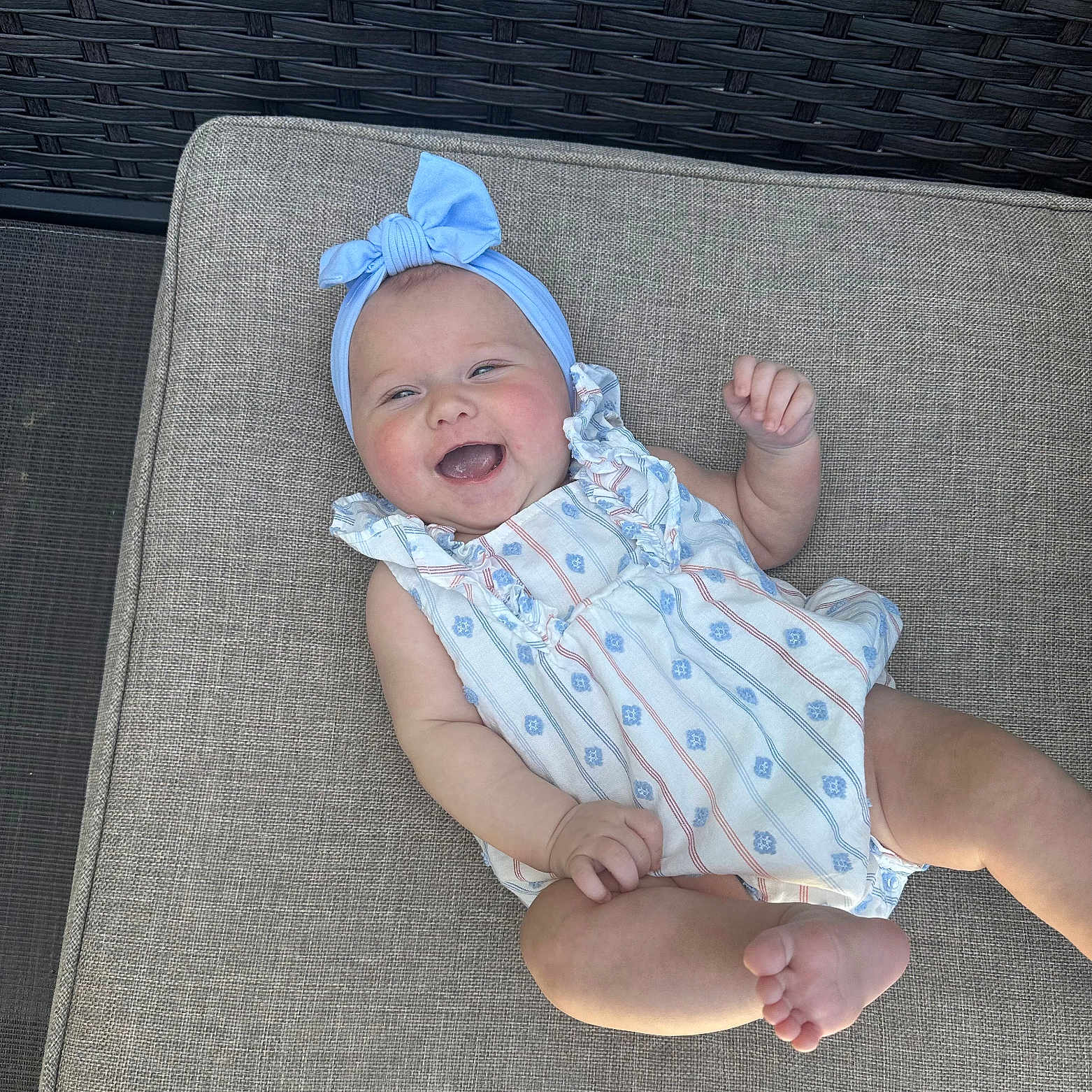 Louella is registered to the contest to win money with this photo: baby, bonnet, cap, chair, clothing, couch, cushion, dress, face, furniture, happy, hat, head, homedecor, laughing, newborn, person, photography, portrait, sitting