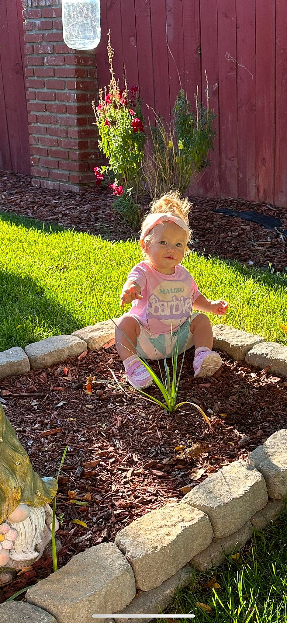 Mya joined the competition — help win amazing prizes! annual_plant, child, compost, garden, gardening, grass, grass_family, groundcover, headwear, landscape, landscaping, lawn, lawn_ornament, mulch, people_in_nature, person, plant, shrub, sitting, soil