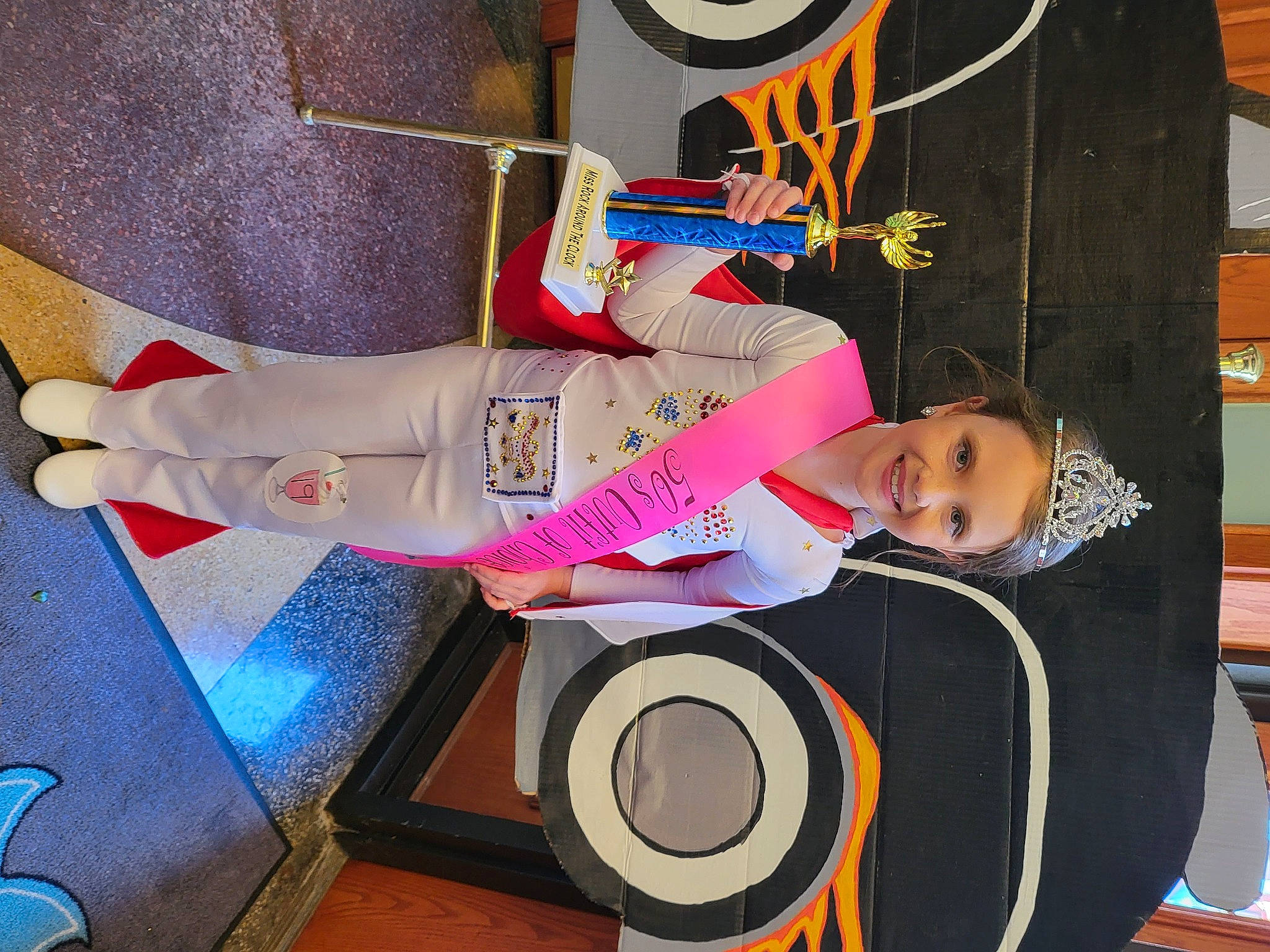 Korie joined the competition — help win amazing prizes! art, audio_equipment, child, flooring, fun, headwear, human_leg, joy, knee, leisure, organ, person, photography, product, room, space, sportswear, t_shirt, thigh, tire