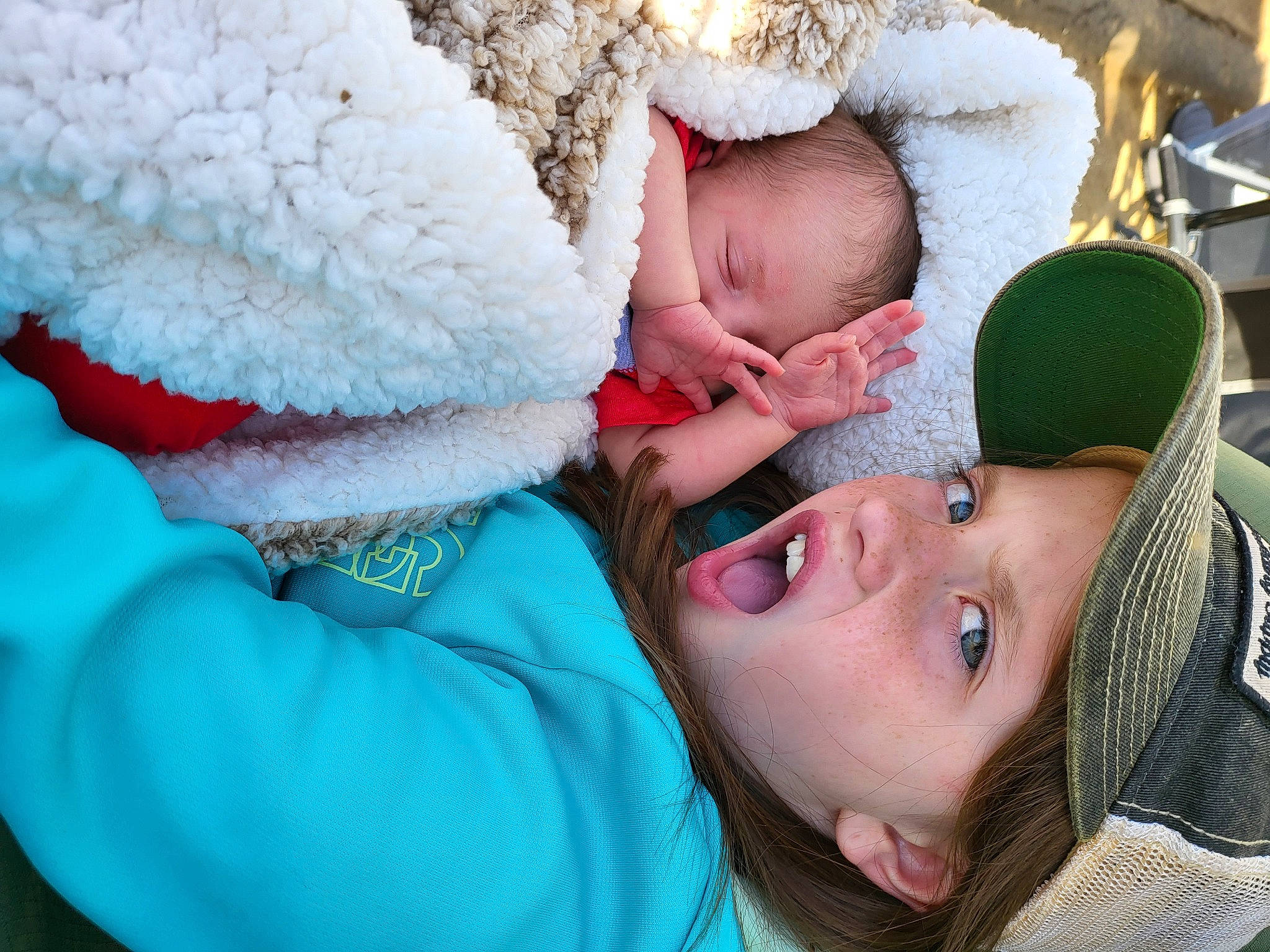 Korie is registered to the contest to win money with this photo: baby, cap, child, comfort, eye, facial_expression, freezing, happy, headwear, human_body, interaction, knit_cap, leisure, mouth, nose, person, pink, skin, surprise, textile