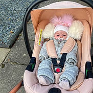 Millie Mae joined the competition — help win amazing prizes! baby, stroller, pacifier, hat, pom_poms, coat, baby_clothes, outdoor, sidewalk, gravel, pavement, infant, child, seat_belt, car_seat, pink, gray, winter_clothing, warm, bundle