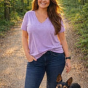 Glitter is registered to the contest to win money with this photo: woman, dog, outdoor, forest, path, sunlight, smiling, casual_clothing, standing, nature, trees, pet, happy, leisure, portrait, walking, daylight, animal, relaxed, friendship