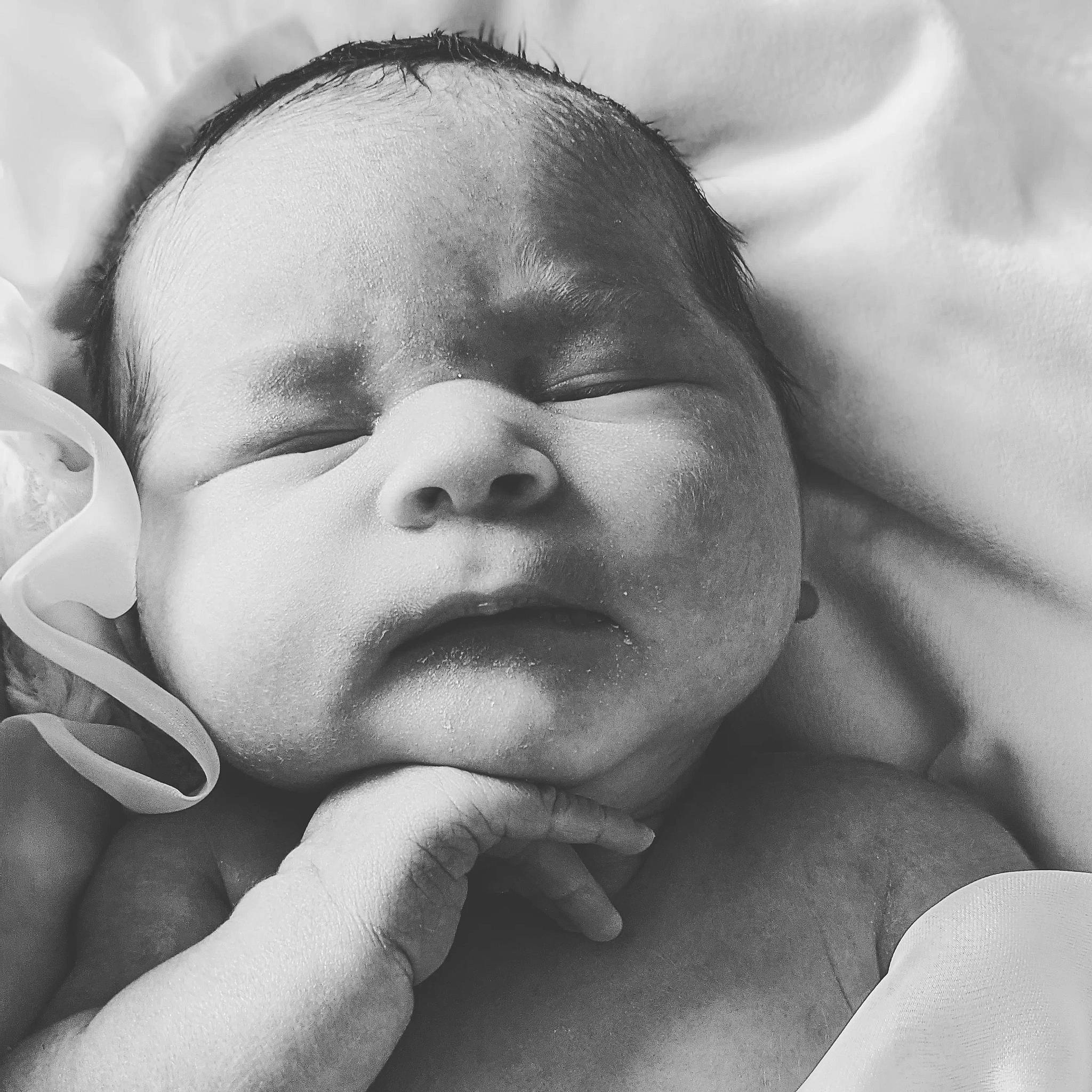 Kylie is registered to the contest to win money with this photo: baby, baby_sleeping, cheek, child, chin, comfort, ear, eyebrow, face, gesture, hand, happy, head, iris, lip, mouth, nose, people, person, skin