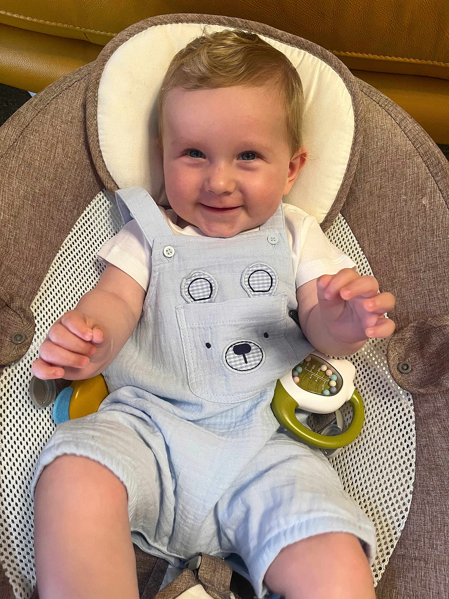Marley joined the competition — help win amazing prizes! baby, smiling, child, infant, overalls, baby_seat, toy, happy, cute, face, hands, blue_clothing, indoor, cushion, mesh, seat_belt, skin, blond_hair, portrait, young_child
