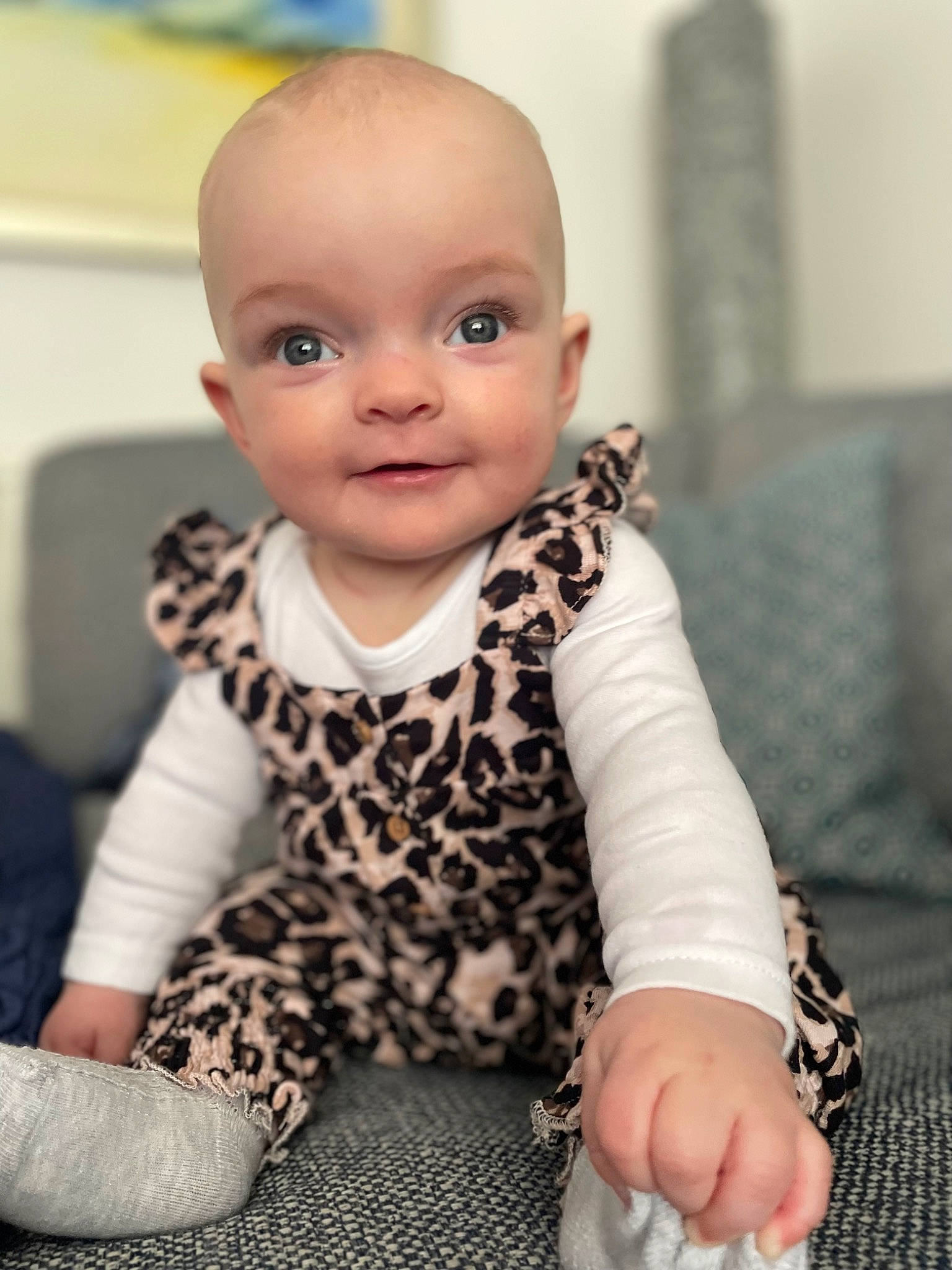 Willow Rae is registered to the contest to win money with this photo: baby, baby_toddler_clothing, cheek, child, comfort, flooring, fur, happy, iris, neck, pattern, person, portrait_photography, room, sitting, skin, sleeve, toddler