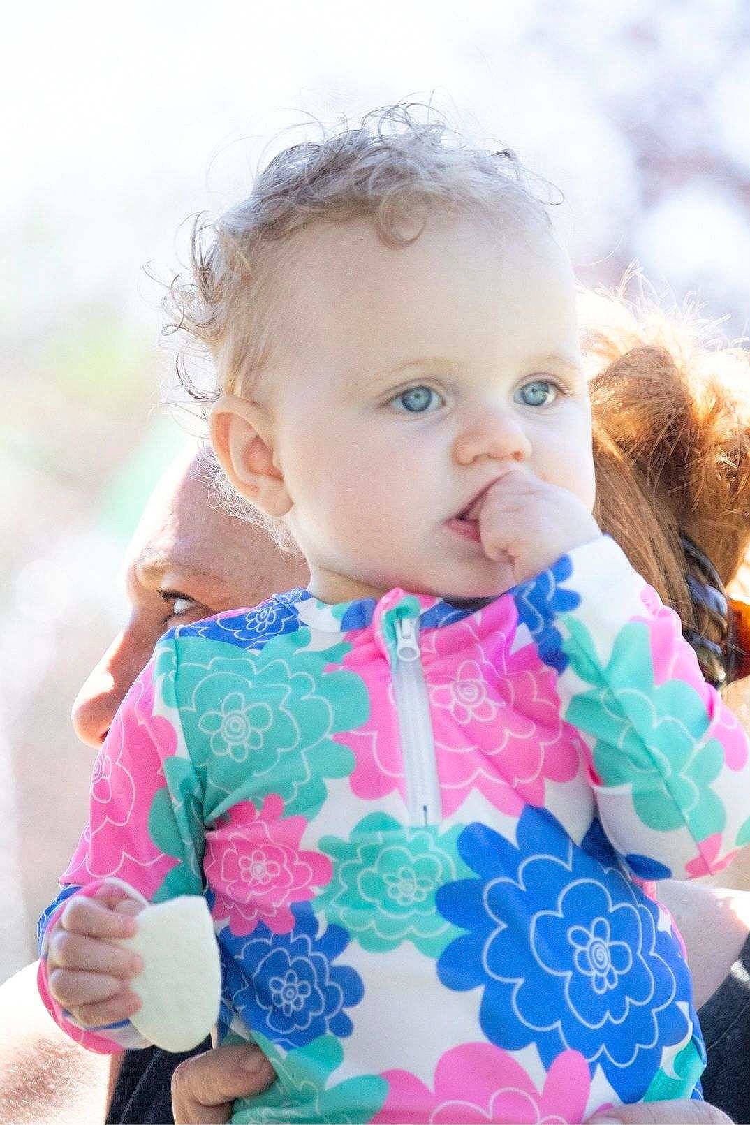 Charlotte joined the competition — help win amazing prizes! baby, baby_toddler_clothing, cheek, child, eye, face, facial_expression, grass, hairstyle, happy, iris, lip, outerwear, people_in_nature, person, pink, product, skin, sleeve, textile