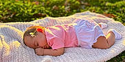 Brynli joined the competition — help win amazing prizes! baby, sleeping, blanket, outdoor, grass, flower, sunlight, peaceful, nature, child, infant, pink_clothing, white_shorts, cute, relaxation, portrait, soft_texture, greenery, daylight, serene