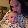 Axel is registered to the contest to win money with this photo: baby, infant, mother, parent, child, face, portrait, selfie, cuddling, sitting, indoors, home, pajamas, onesie, smiling, family, cat_tree, warm_lighting, closeup, adorable