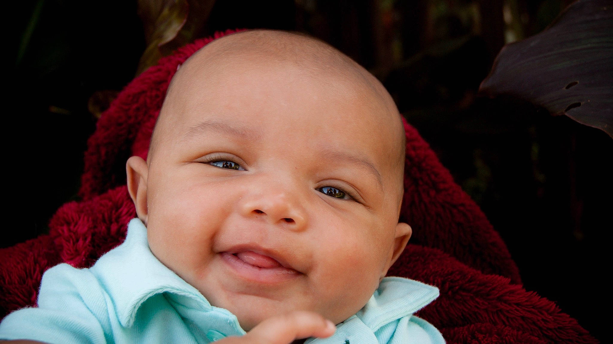 Jalen is registered to the contest to win money with this photo: baby, baby_toddler_clothing, cheek, child, chin, close_up, eye, eyebrow, eyelash, grass, happy, iris, lip, mouth, nose, person, pink, plant, skin, smile