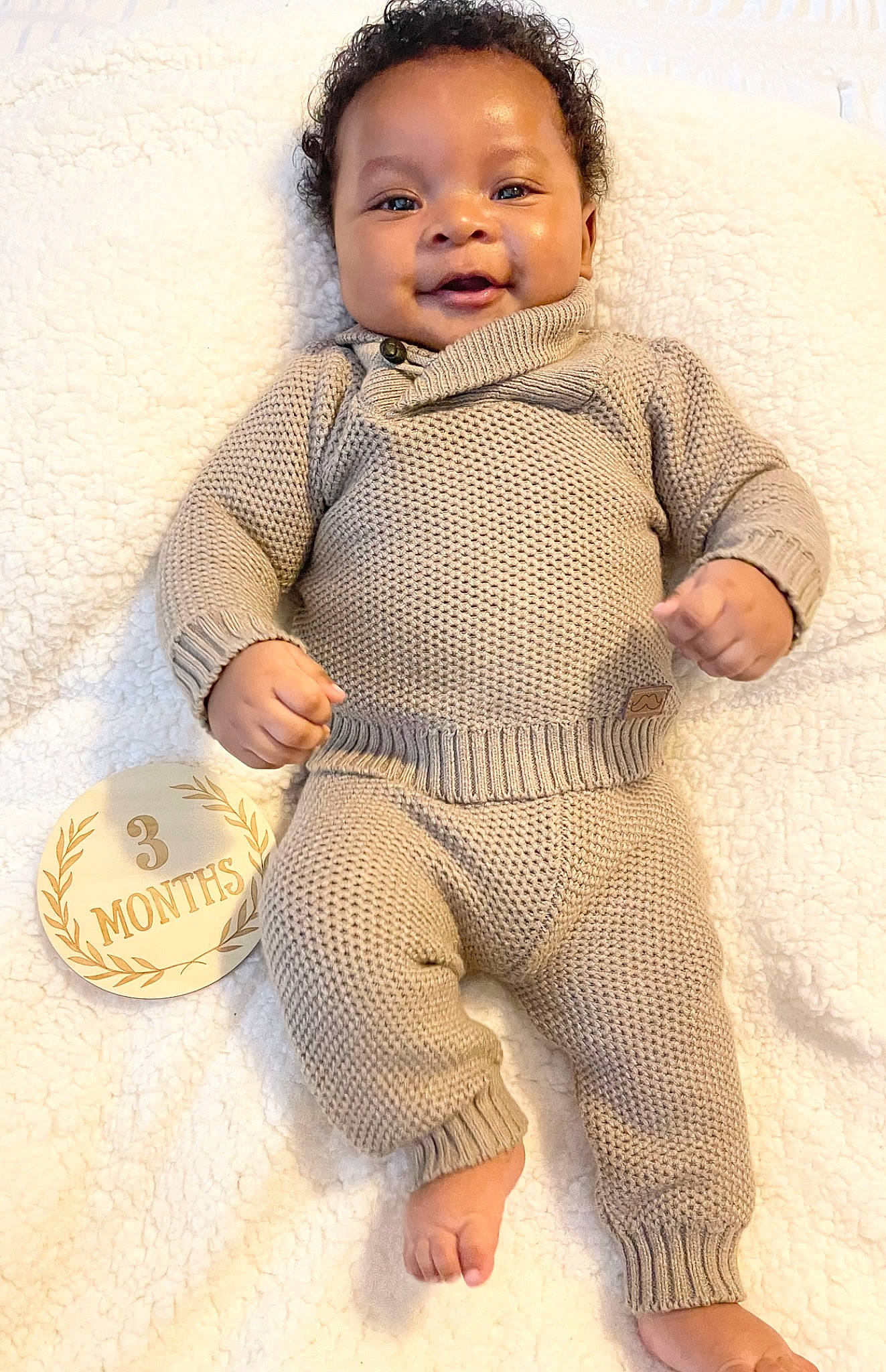 Brysen is registered to the contest to win money with this photo: art, baby, baby_toddler_clothing, barefoot, cheek, child, eye, flooring, happy, head, pattern, person, serveware, sitting, skin, sleeve, smile, toddler, vintage_clothing, waist