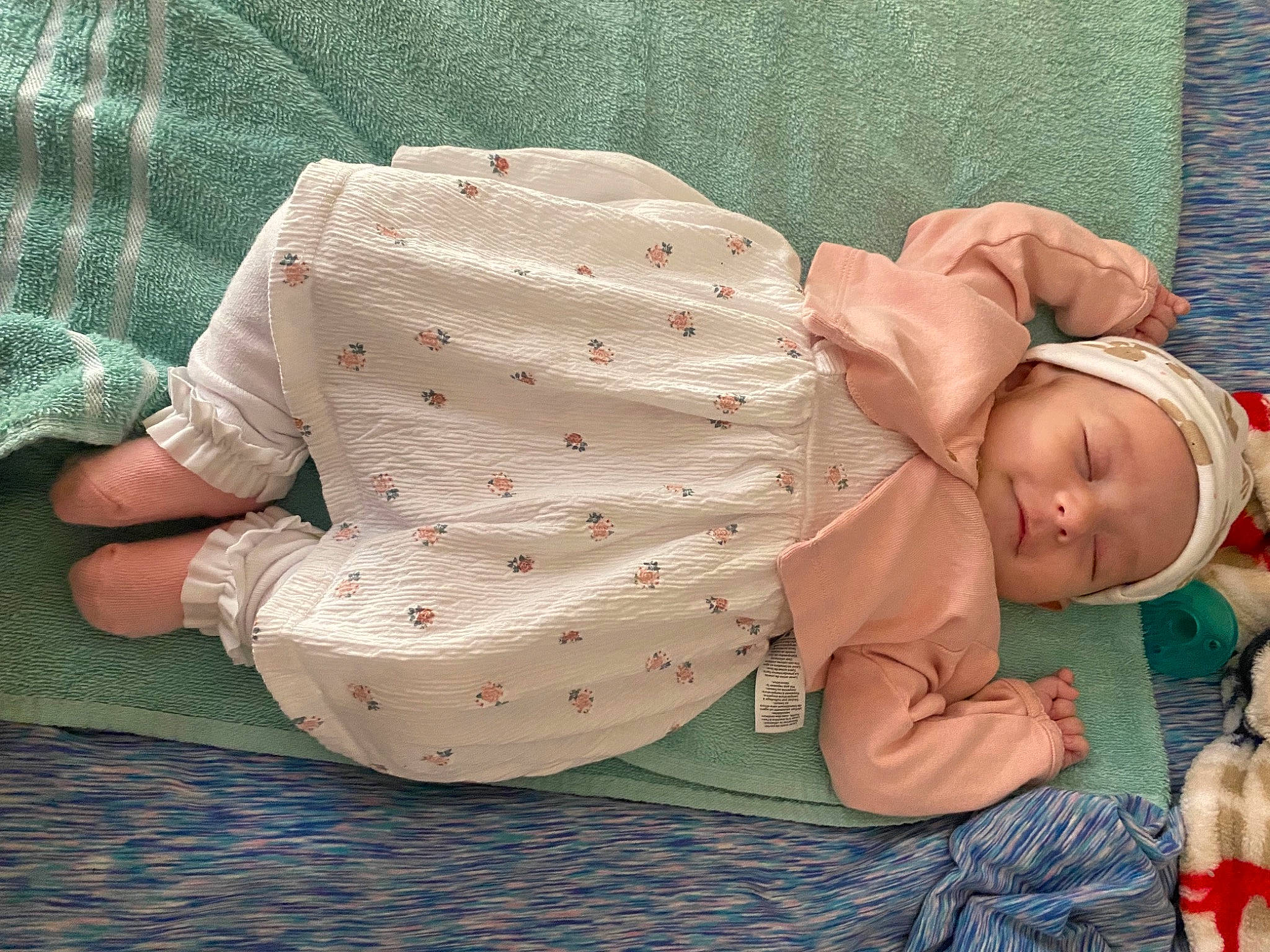 Charley is registered to the contest to win money with this photo: abdomen, baby, baby_products, baby_sleeping, baby_toddler_clothing, child, comfort, grass, hand, hat, human_body, lap, linens, nap, pattern, person, sitting, sleep, sleeve, toddler