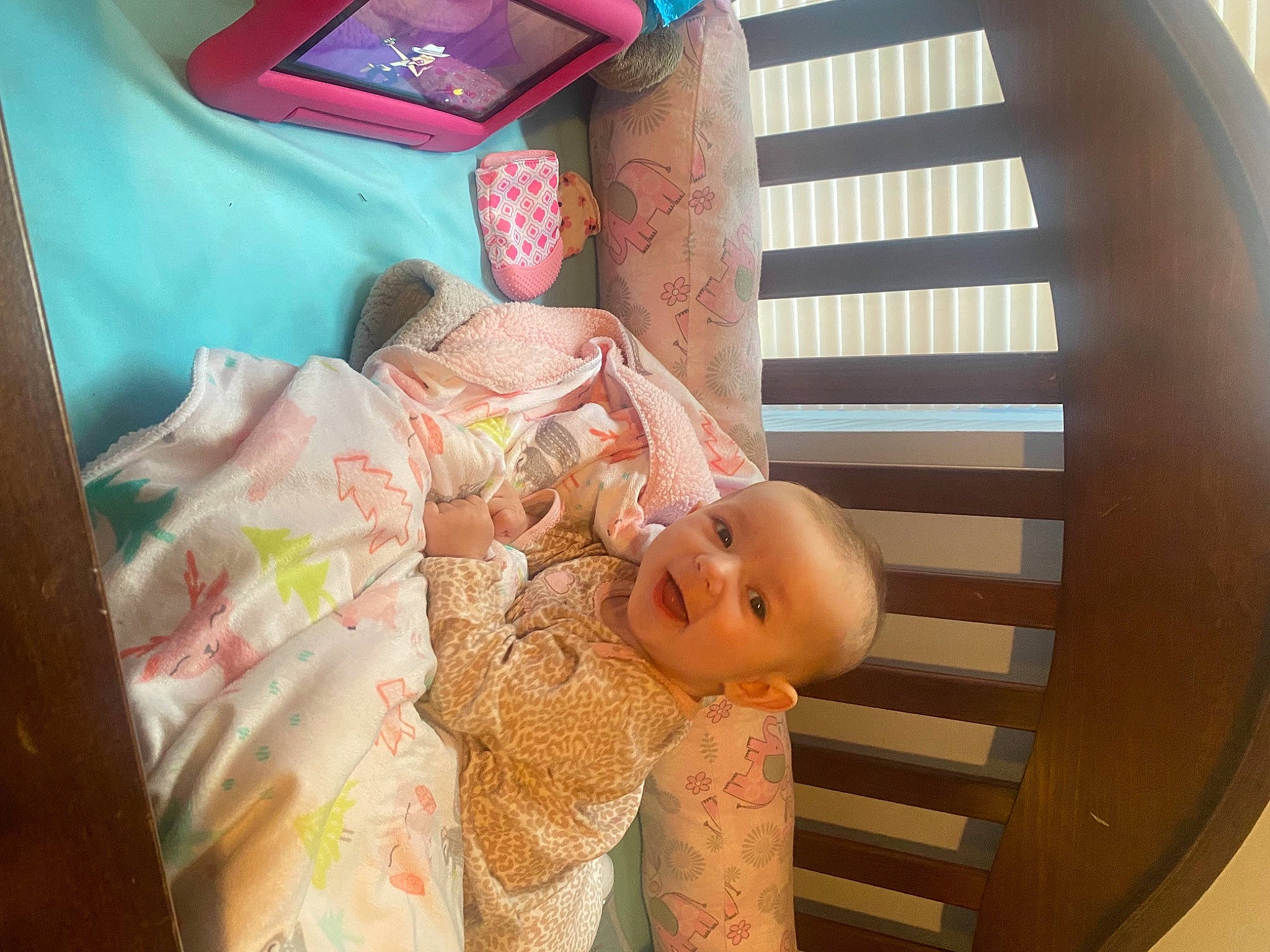 Charley is registered to the contest to win money with this photo: baby, baby_products, baby_safety, baby_sleeping, baby_toddler_clothing, child, circle, comfort, finger, linens, peach, person, pink, room, skin, smile, textile, toddler, window