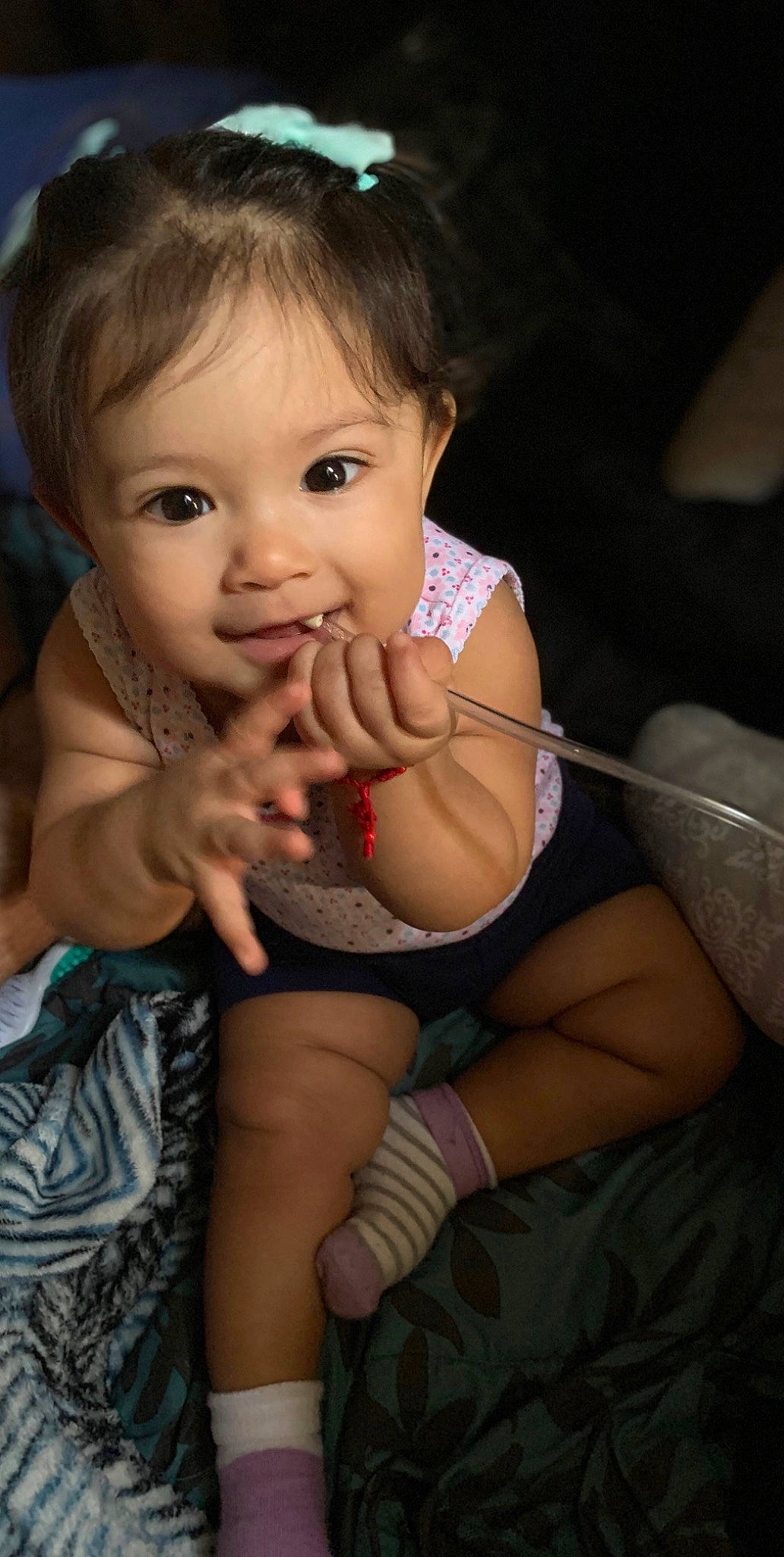 Sia is registered to the contest to win money with this photo: arm, baby, black_hair, cheek, child, finger, gesture, hand, leg, mouth, muscle, nose, person, skin, smile, thigh, thumb, toddler