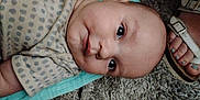 Kasson is registered to the contest to win money with this photo: baby, carpet, casual, closeup, clothing, cute, eyes, face, floor, foot, head, indoor, infant, mouth, person, polka_dot, sandals, skin, toenail_paint, towel