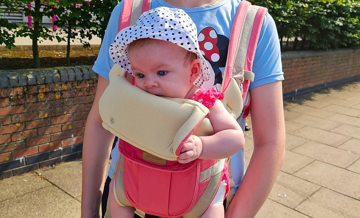 Ruxandra is registered to the contest to win money with this photo: baby, baby_carriage, baby_products, baby_toddler_clothing, cap, child, fashion_accessory, fun, grass, happy, interaction, leisure, person, personal_protective_equipment, pink, plant, recreation, sitting, skin, thigh