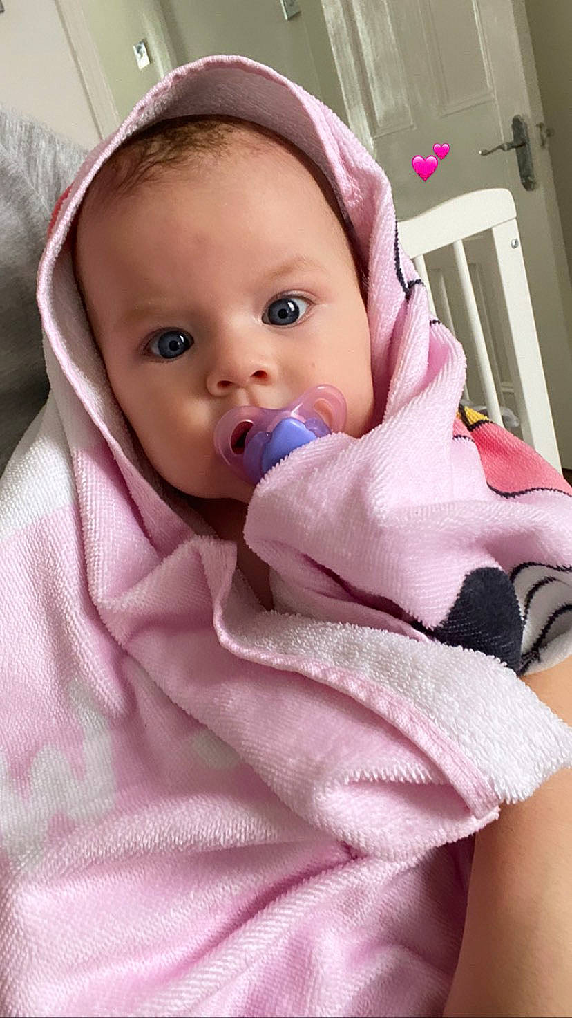 Ruxandra is registered to the contest to win money with this photo: baby, baby_safety, baby_toddler_clothing, cheek, chin, comfort, eyebrow, eyelash, face, head, iris, linens, lip, mouth, nose, person, pink, skin, sleeve, textile