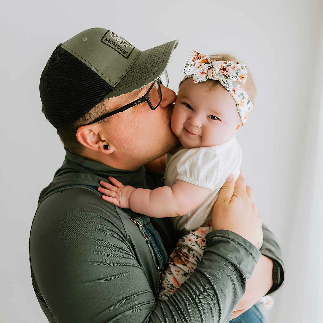 Nora joined the competition — help win amazing prizes! baby, person, kiss, smile, headband, cap, glasses, affection, love, holding, portrait, indoor, cute, child, family, tender, happy, light, casual, clothing