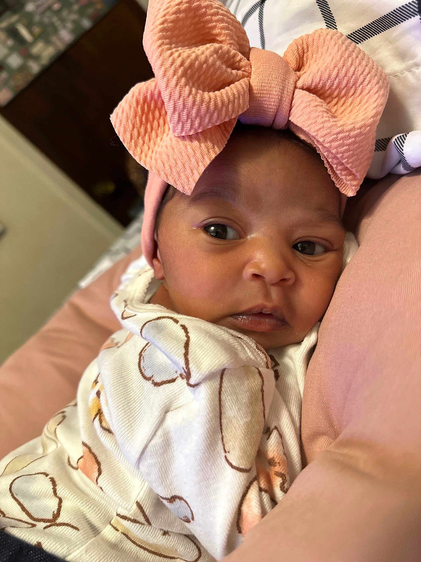 Love joined the competition — help win amazing prizes! baby, infant, headband, bow, pink, pajamas, cute, face, eyes, skin, clothing, soft, cushion, indoors, portrait, child, newborn, closeup, person, sleepwear