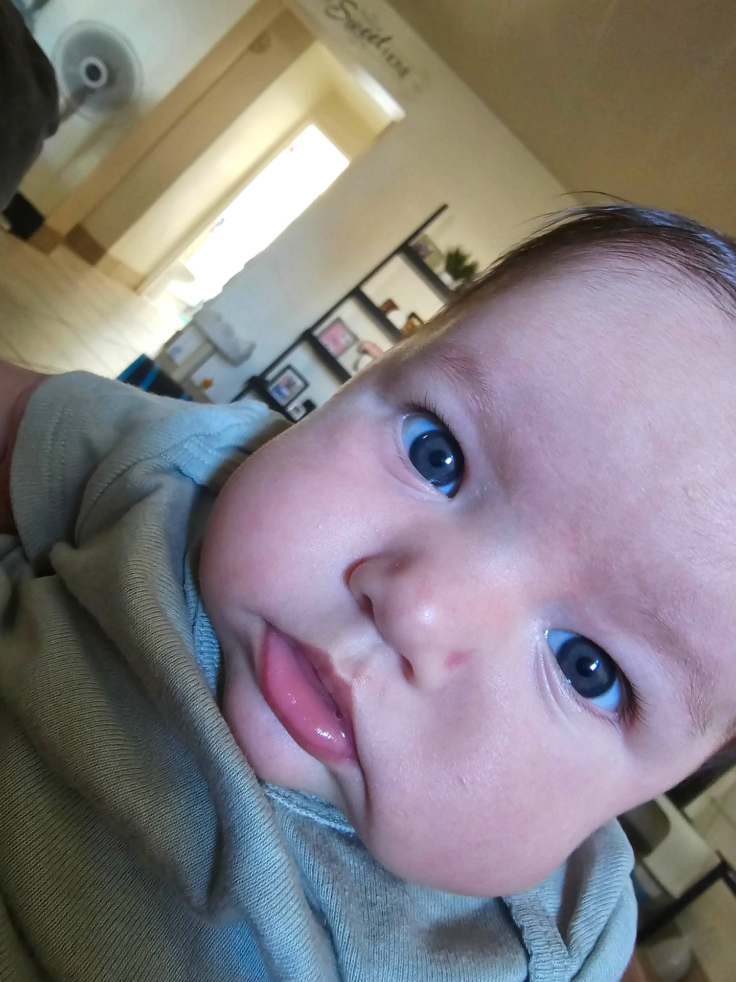 Violetta is registered to the contest to win money with this photo: baby, bodypart, clothing, face, finger, hand, happy, head, hoodie, indoors, knitwear, mouth, newborn, person, photography, portrait, selfie, smile, sweater, sweatshirt