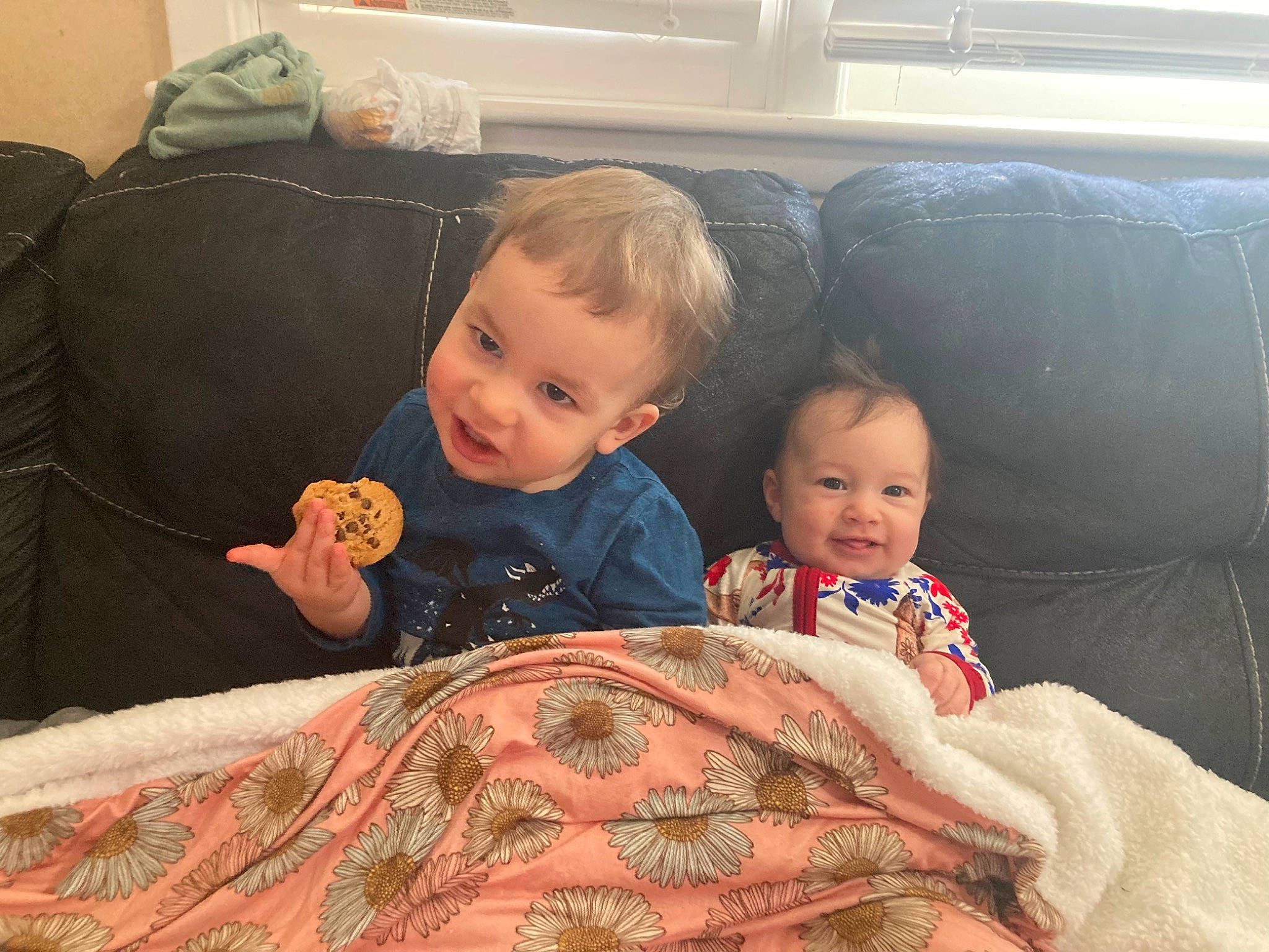 Emma joined the competition — help win amazing prizes! baby, cheek, child, comfort, couch, eye, face, finger, happy, head, human_body, joy, lap, linens, mammal, mouth, person, sitting, skin, smile