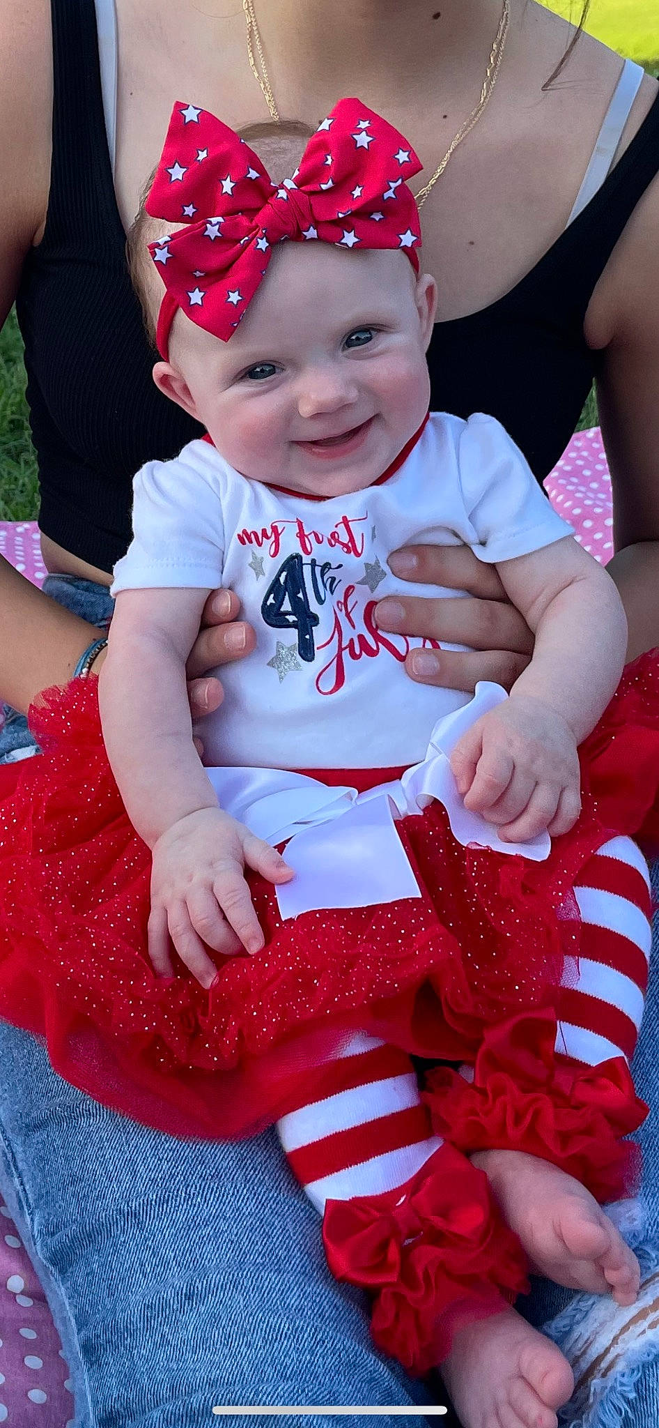 Oakley is registered to the contest to win money with this photo: baby, baby_toddler_clothing, child, event, facial_expression, fun, grass, happy, hat, headwear, joy, magenta, pattern, person, photograph, pink, product, red, skin, sleeve