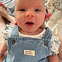 Gracie is registered to the contest to win money with this photo: baby, denim, clothing, peter_rabbit, child, infant, cute, portrait, face, person, smile, bed, hand, nail_polish, fabric, soft, closeup, blue, white, casual