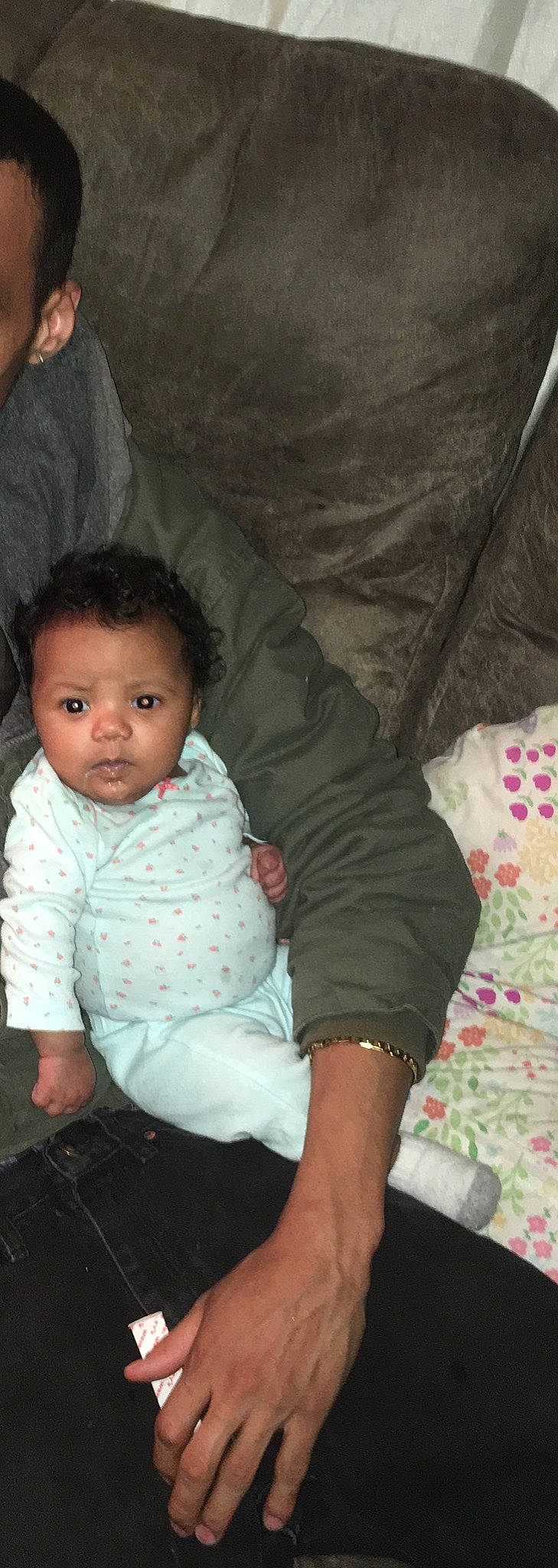 Ayanna is registered to the contest to win money with this photo: abdomen, baby, black_hair, cheek, child, eye, iris, nose, person, sitting, skin, smile, toddler