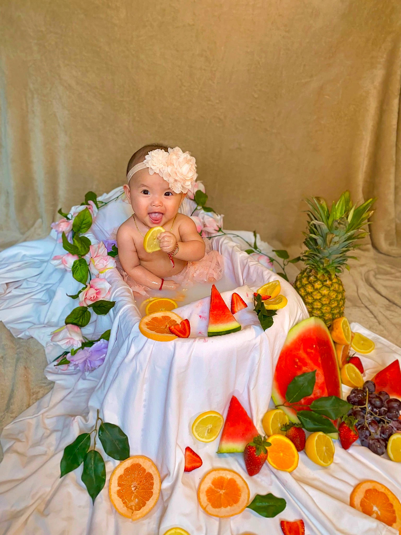 Jade is registered to the contest to win money with this photo: ananas, baby, baby_toddler_clothing, clementine, event, food, food_group, fruit, happy, headwear, ingredient, mandarin_orange, natural_foods, orange, painting, person, petal, pineapple, plant, recipe