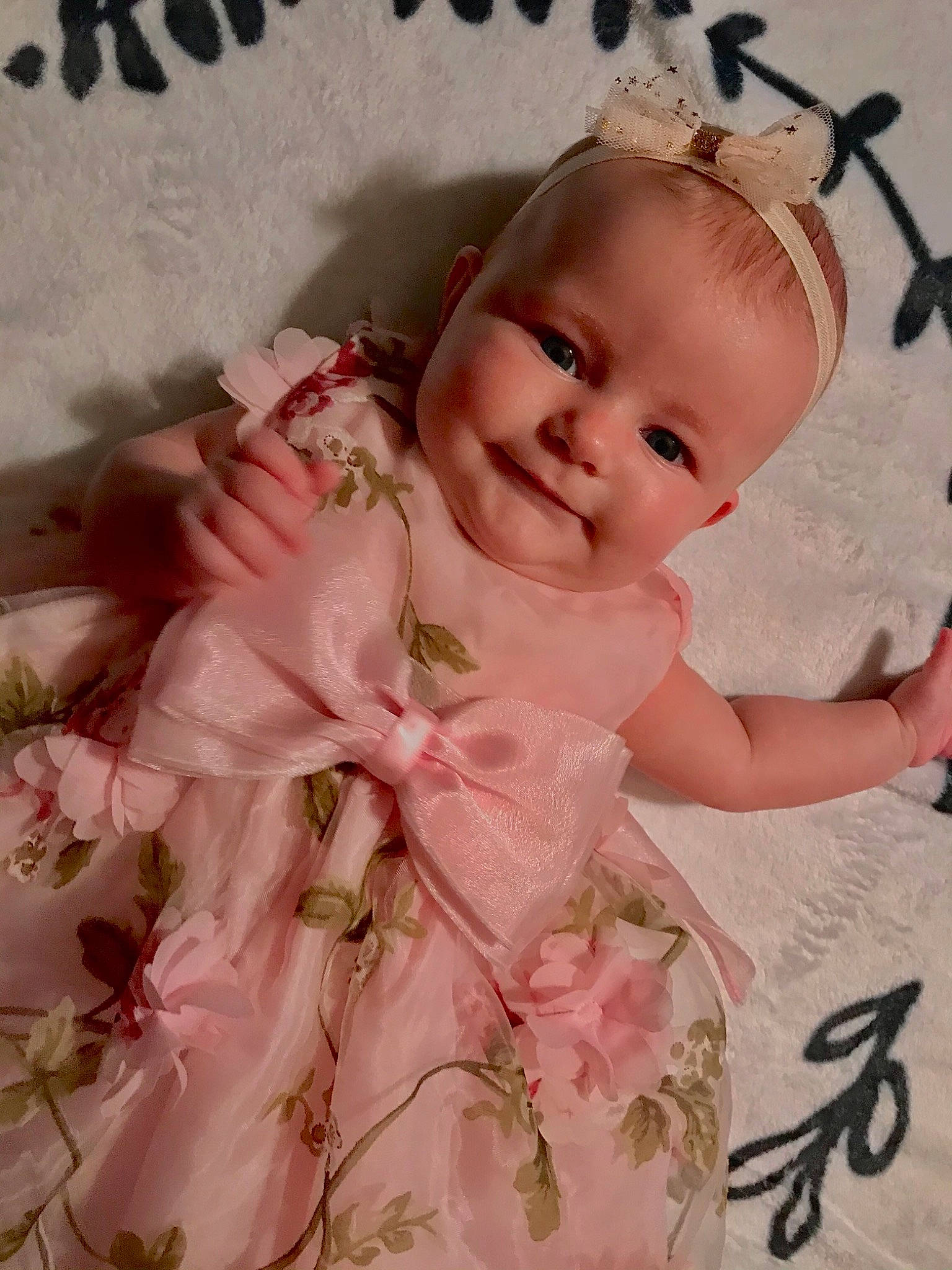 Rose Gail is registered to the contest to win money with this photo: baby, baby_products, baby_toddler_clothing, cut_flowers, day_dress, embellishment, hair_accessory, peach, person, pink