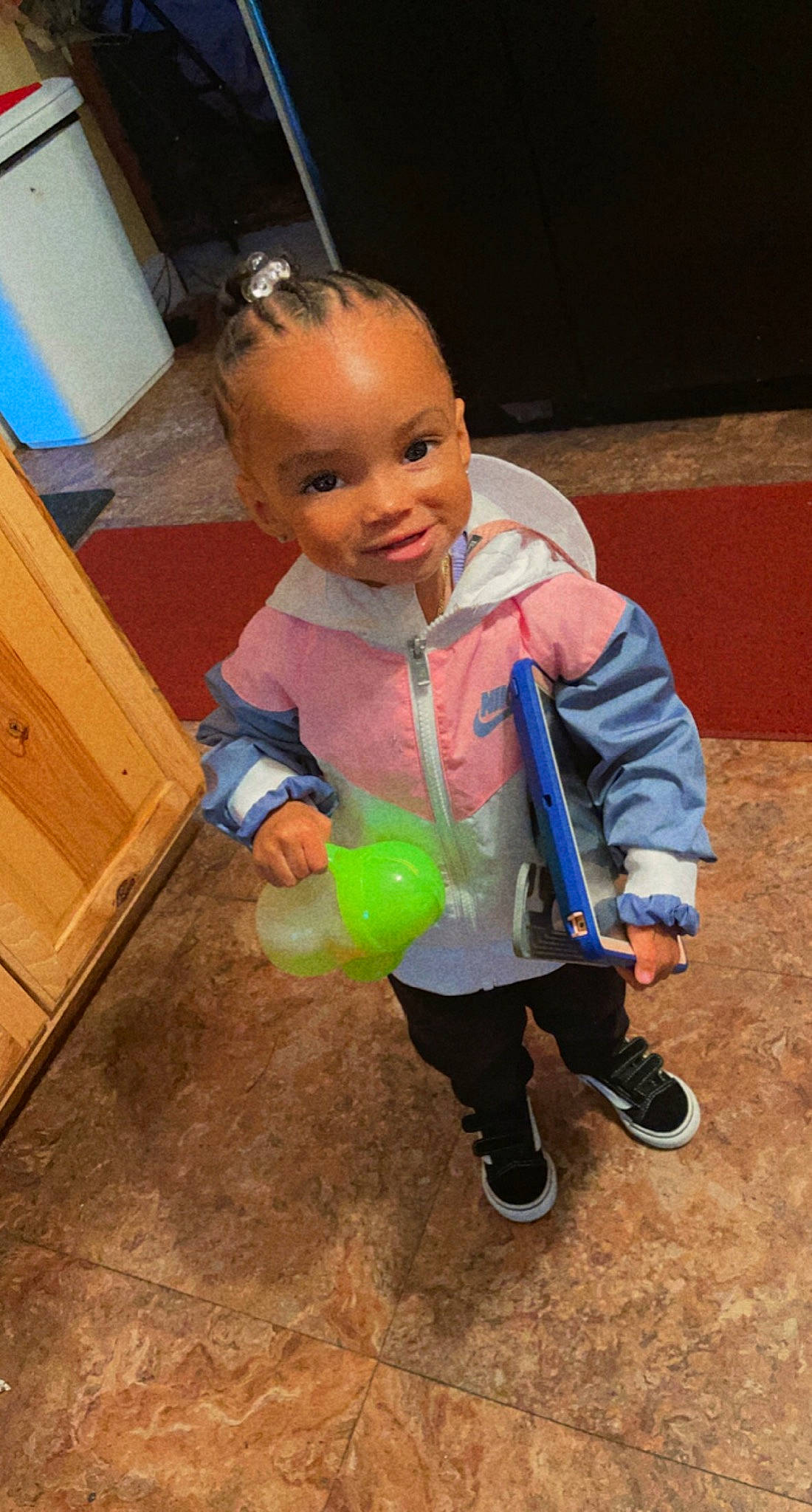 Zaria is registered to the contest to win money with this photo: baby, baby_products, baby_toddler_clothing, baby_toys, cabinetry, chest_of_drawers, child, costume, cupboard, drawer, flooring, fun, happy, party_supply, person, personal_protective_equipment, play, smile, soil, toddler