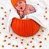 baby, newborn, child, portrait, pumpkin, halloween, orange, blanket, white_blanket, candy_corn, costume, infant, lying_down, sleeping_area, cute, surprised, open_mouth, indoor, seasonal, photography