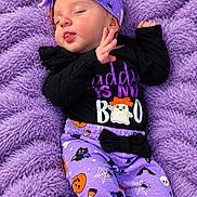 Eriel joined the competition — help win amazing prizes! baby, newborn, sleeping, portrait, purple_blanket, fluffy_blanket, halloween, costume, bat_pattern, pumpkin_pattern, black_clothing, purple_clothing, headband, bow, peaceful, tongue_out, raised_hand, indoors, close_up, cute