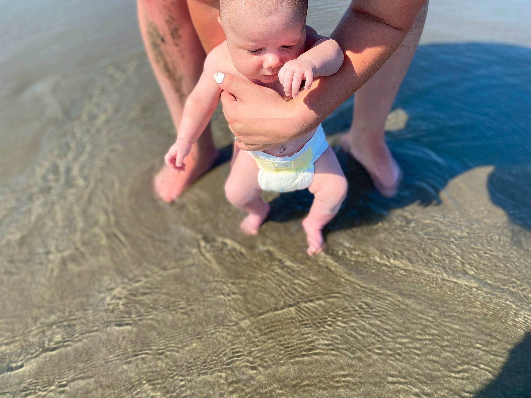 Edison joined the competition — help win amazing prizes! arm, baby, barefoot, body_of_water, finger, foot, fun, gesture, happy, human_body, leg, leisure, people_in_nature, people_on_beach, person, recreation, sand, summer, thigh, toddler