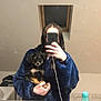 Shanelle a rejoint le concours — aidez-le/la à gagner de superbes lots ! bathroom, black_dog, blue_robe, counter, dog, hand, holding, indoor, mirror, person, pet, phone, puppy, reflection, selfie, sink, tan_dog, toiletries, wet_hair, window