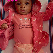 Isabella joined the competition — help win amazing prizes! baby, child, infant, hoodie, pink_clothing, heart_pattern, lying_down, cute, adorable, soft_toys, bed, blanket, portrait, young_child, love_emojis, casual_wear, indoor, face, eyes, smile