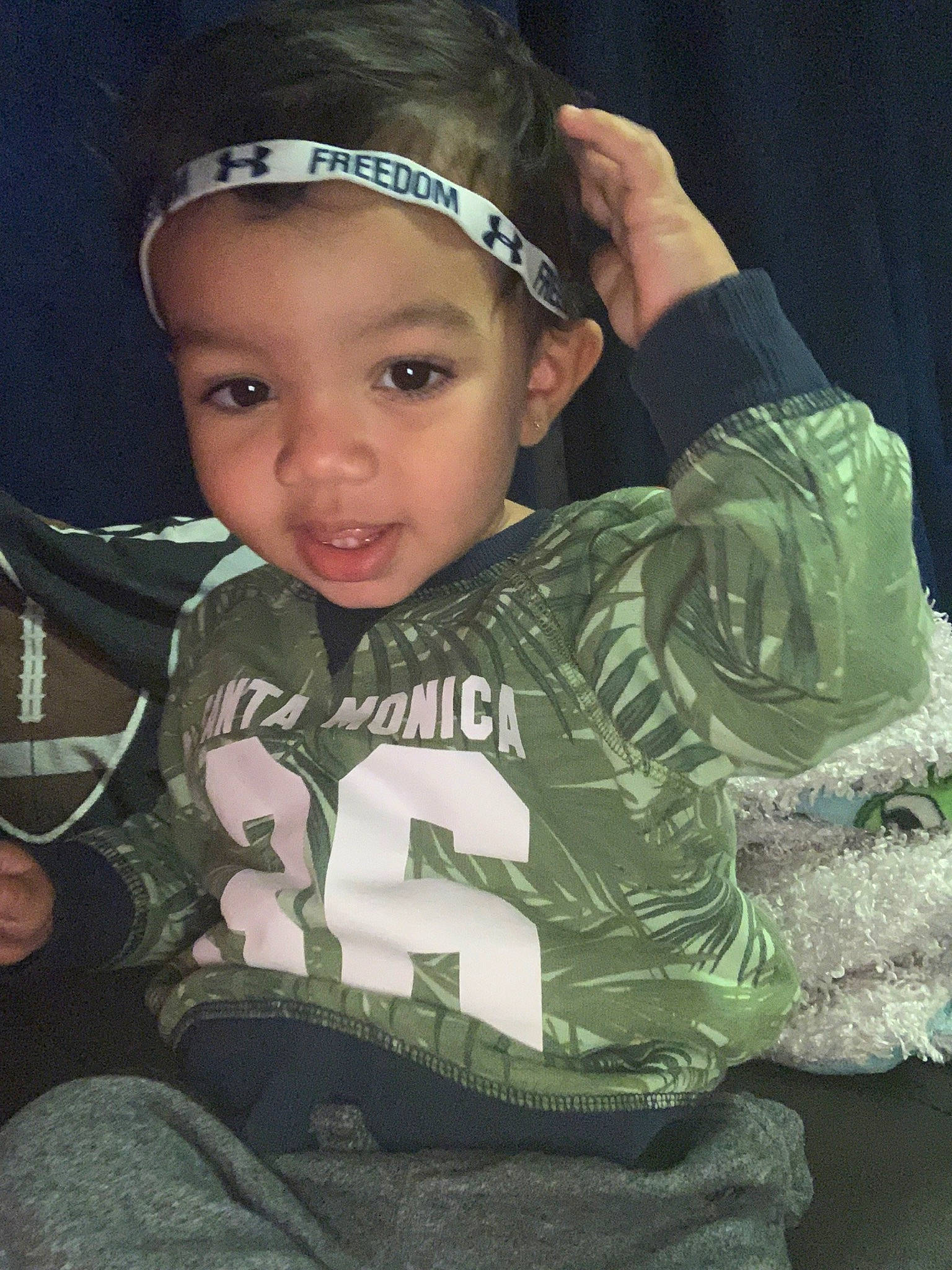 Lee is registered to the contest to win money with this photo: arm, baby, camouflage, cheek, child, cool, ear, fashion_accessory, forehead, hair_accessory, head, headband, headgear, headpiece, headwear, military_camouflage, person, photography, toddler