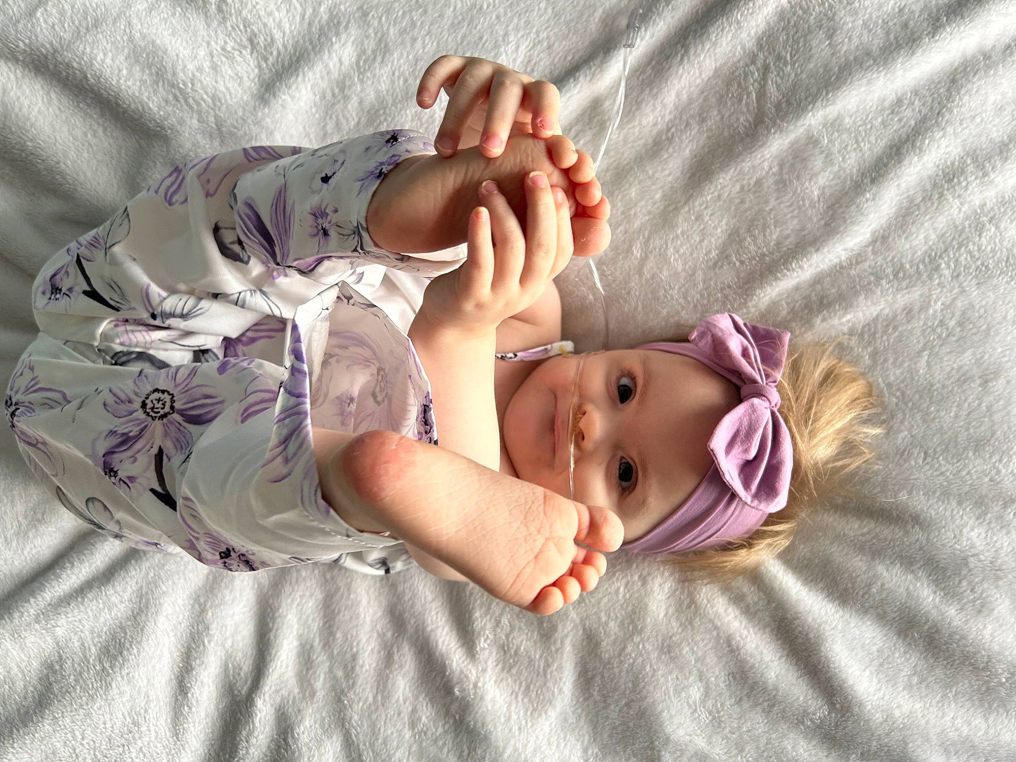 Laila joined the competition — help win amazing prizes! baby, baby_products, baby_toddler_clothing, child, comfort, eyelash, finger, foot, gesture, hand, human_body, linens, nail, person, pink, product, skin, sleeve, textile, thumb