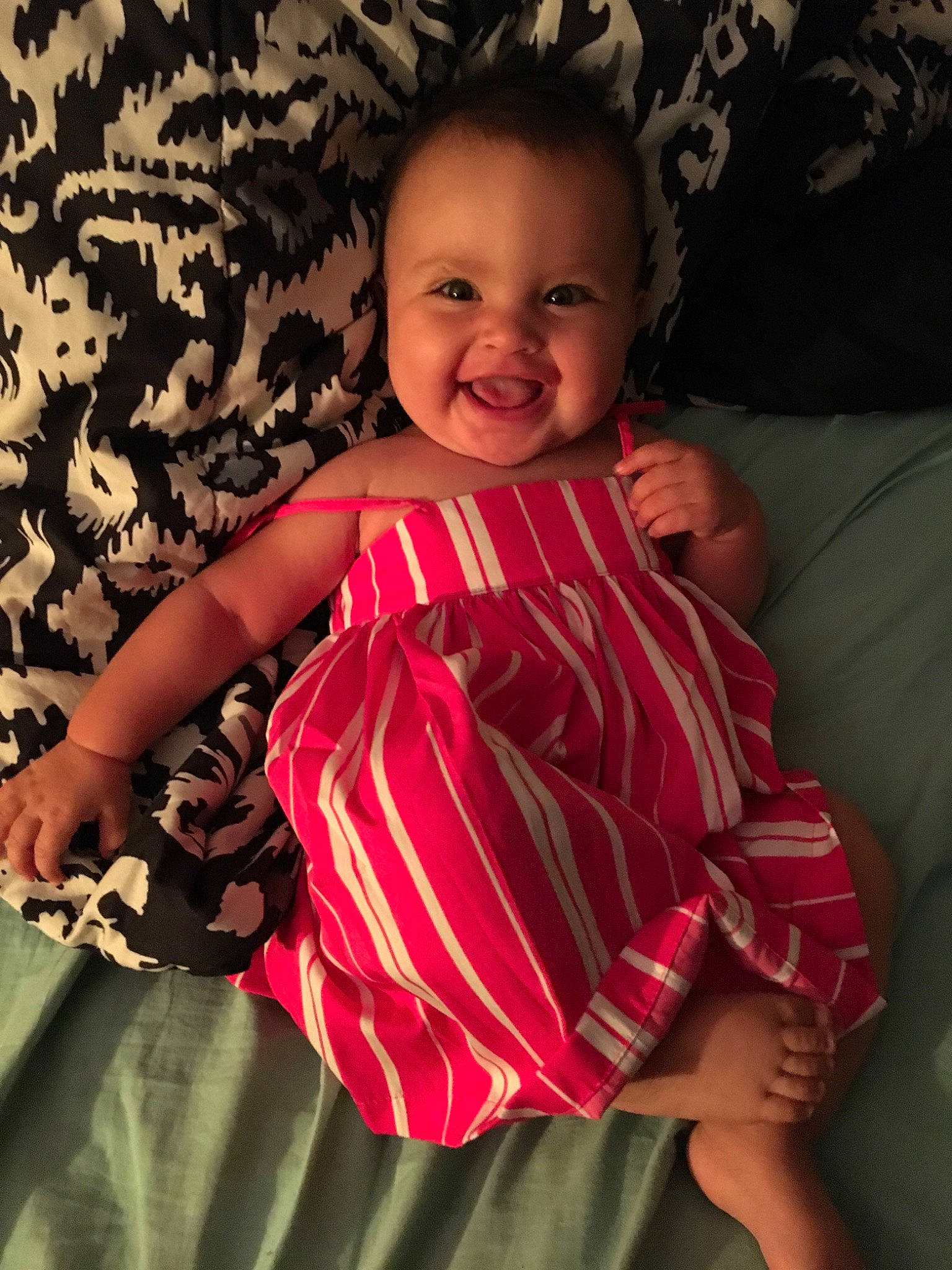 Kayloni is registered to the contest to win money with this photo: arm, baby, baby_products, baby_toddler_clothing, cheek, child, dress, eye, face, head, joy, lip, person, pink, product, sitting, skin, smile, textile, toddler