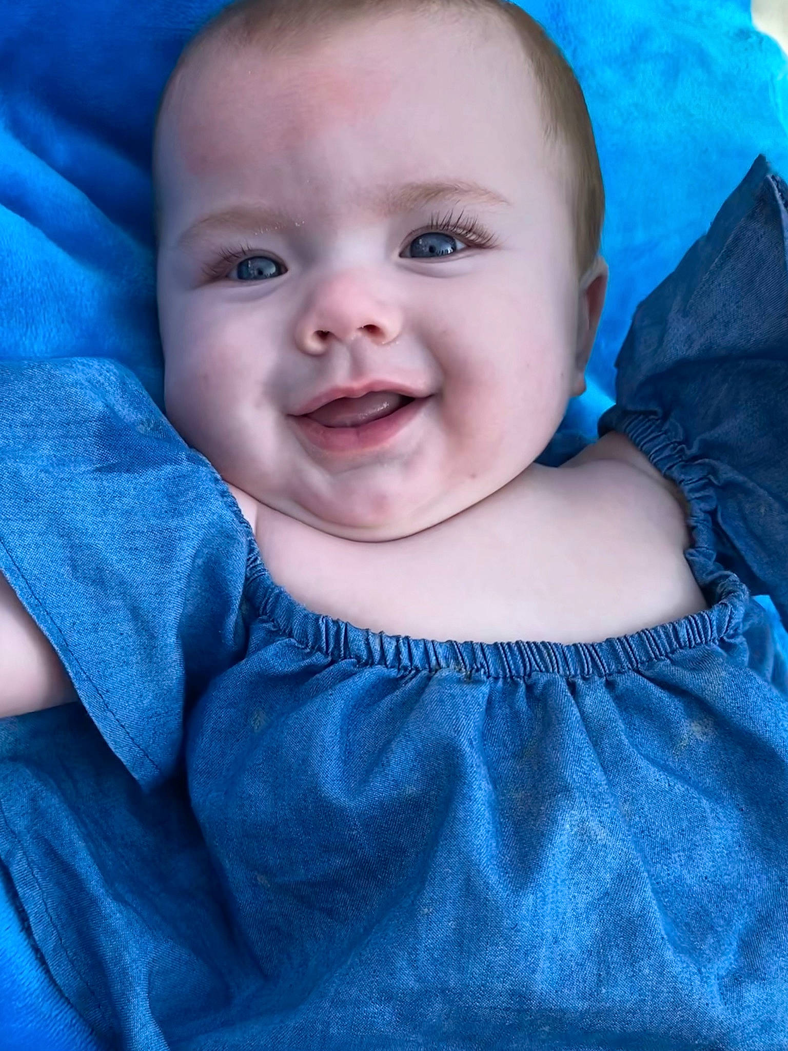 Makenna is registered to the contest to win money with this photo: azure, baby, baby_toddler_clothing, blue, cheek, eye, face, flash_photography, happy, iris, joy, lip, neck, nose, outerwear, person, product, purple, skin, sleeve