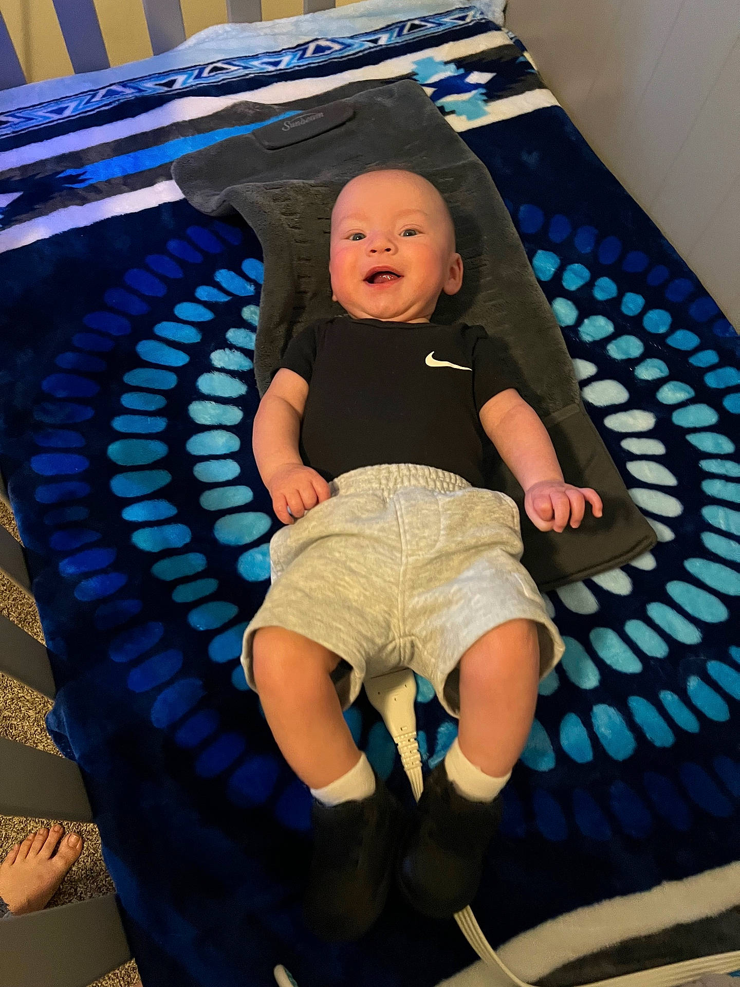Mikey joined the competition — help win amazing prizes! baby, bed, blanket, clothing, crib, cushion, face, footwear, furniture, head, homedecor, infantbed, jeans, pants, person, photography, portrait, shoe, shorts, t_shirt