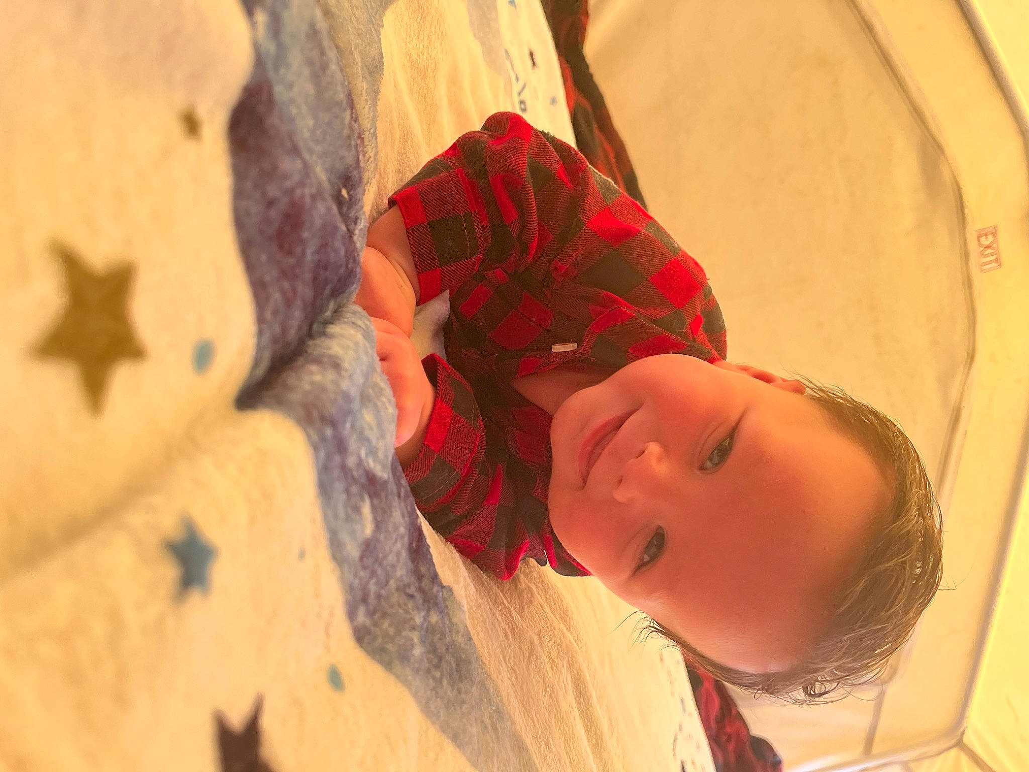 Wade is registered to the contest to win money with this photo: arm, baby, carmine, child, dress, fashion_accessory, finger, flooring, fun, happy, human_body, joy, neck, nose, pattern, person, sand, skin, textile, toddler