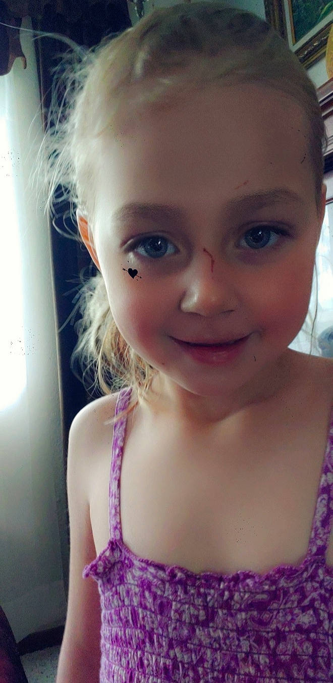 Amy is registered to the contest to win money with this photo: beauty, blond, cheek, child, child_model, chin, ear, eye, eyebrow, face, forehead, hair, hairstyle, head, joy, lip, nose, person, purple, selfie