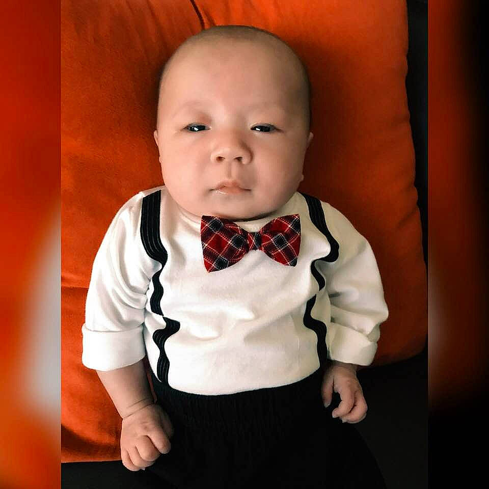 Kota is registered to the contest to win money with this photo: boy, child, infant, neck, outerwear, person, product, toddler