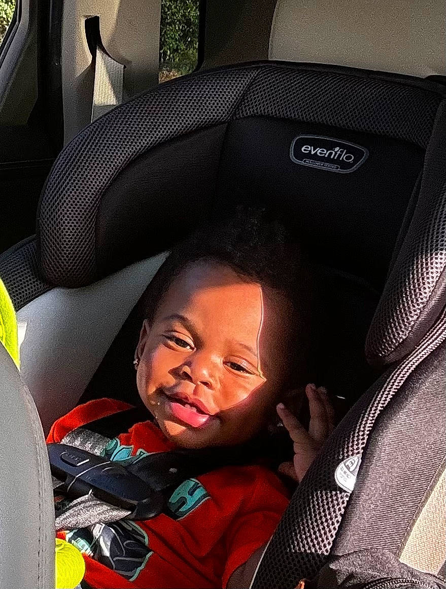Kai joined the competition — help win amazing prizes! boy, car, car_interior, carseat, child, clothing, coat, cushion, face, happy, head, homedecor, jacket, male, person, photography, portrait, smile, transportation, vehicle