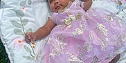 Dyomni is registered to the contest to win money with this photo: baby, infant, dress, bow, cushion, floral, outdoor, grass, pink, gold, socks, headband, cute, sleepy, child, person, portrait, soft, resting, young