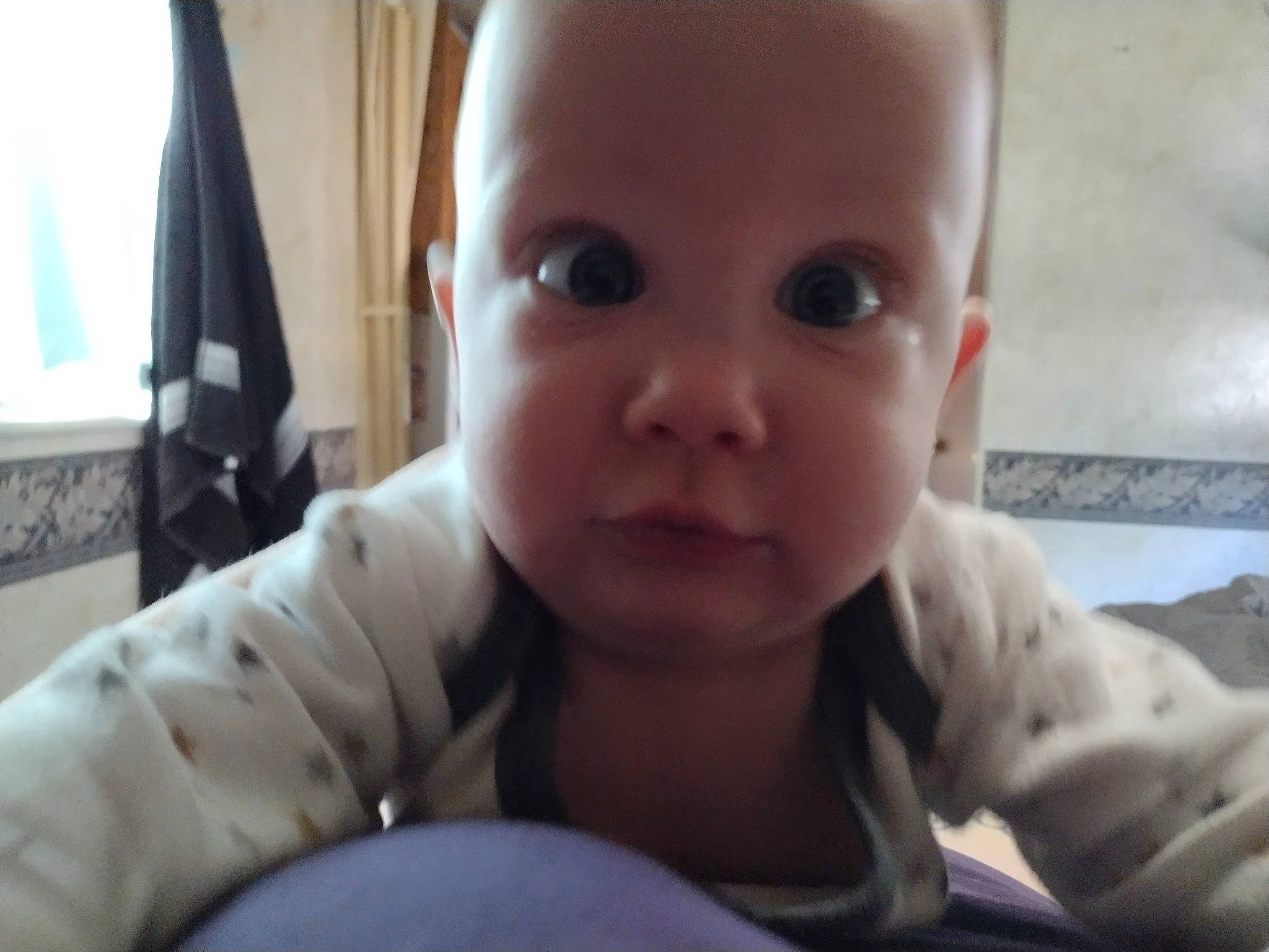 Daphne is registered to the contest to win money with this photo: baby, baby_toddler_clothing, cheek, close_up, comfort, curtain, eyebrow, eyelash, flooring, fun, gesture, head, iris, mouth, nose, person, picture_frame, sleeve, thumb, toddler