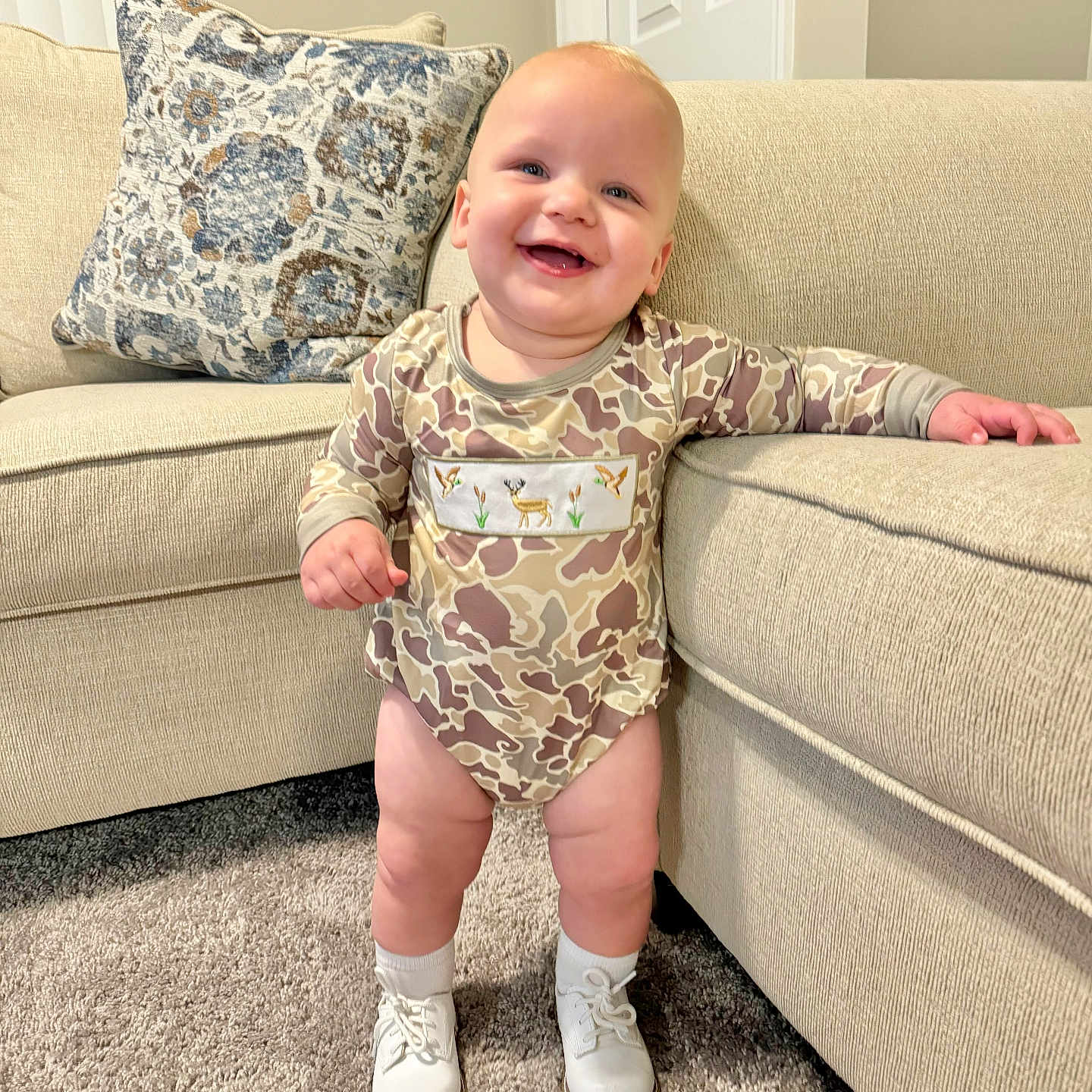 Westin is registered to the contest to win money with this photo: architecture, baby, building, clothing, couch, cushion, face, footwear, furniture, happy, head, homedecor, indoors, livingroom, person, photography, portrait, room, shoe, sitting