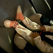 Seyanna participe au concours pour gagner de l'argent avec cette photo : child, car_seat, pajamas, socks, hands, legs, vehicle_interior, seat, straps, safety, infant, baby, clothing, car, seatbelt, cozy, dim_lighting, travel, comfort, young_child